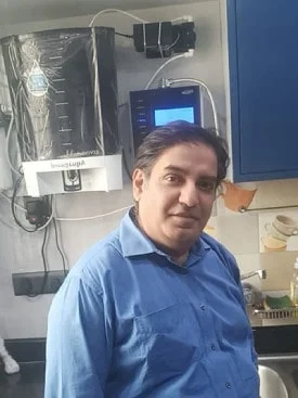 Male taking a water break with his Chanson Quality Water Purifier