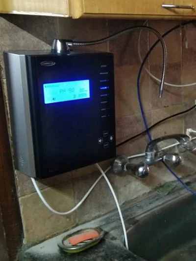 Chanson Quality Water Purifier serving a man with clean water
