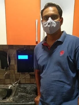 Man maintaining wellness with the Chanson Quality Water Purifier