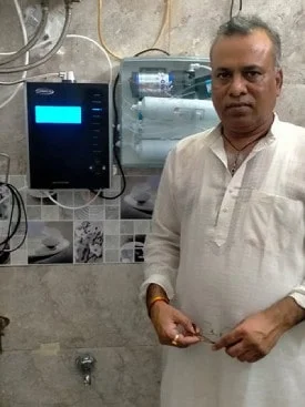 Healthy hydration achieved by a man using Chanson Quality Water Purifier