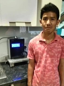 Man engaging with the user-friendly Chanson Water Purifier