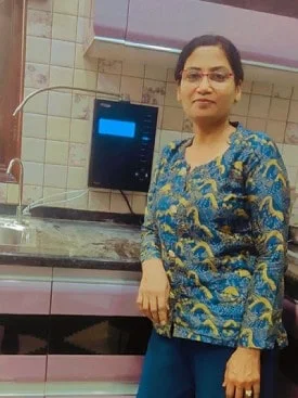 Chanson Quality Water Purifier serving a satisfied female customer