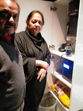 Male demonstrating ease of use of the Chanson Water Purifier