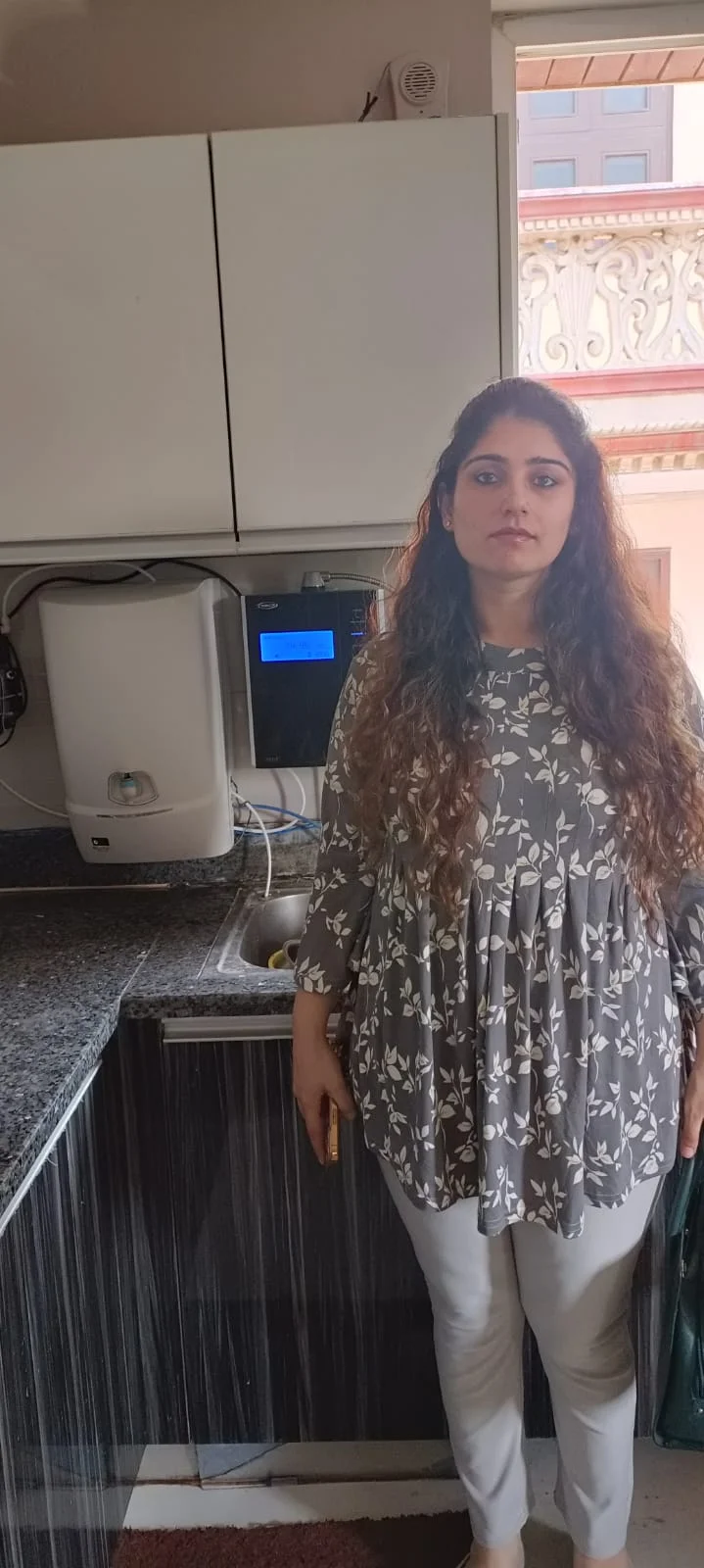 girl relishing the taste of water from his Chanson Quality Water Purifier